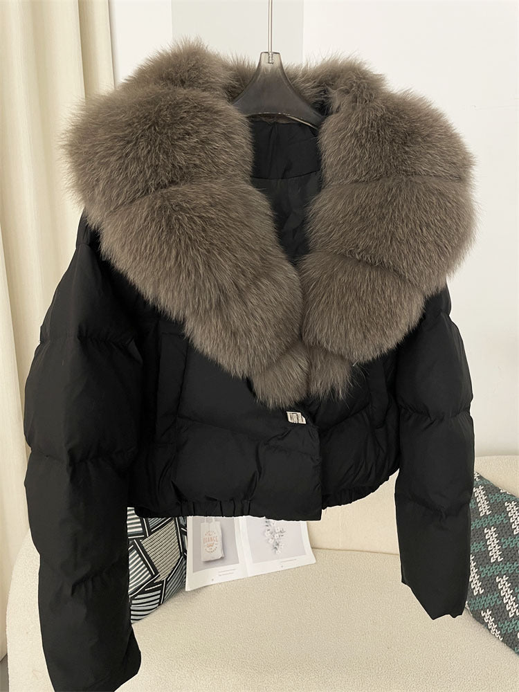 Women's short fashionable warm down jacket with a stylish and oversized real fox fur collar