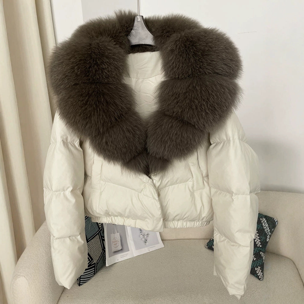 Women's short fashionable warm down jacket with a stylish and oversized real fox fur collar