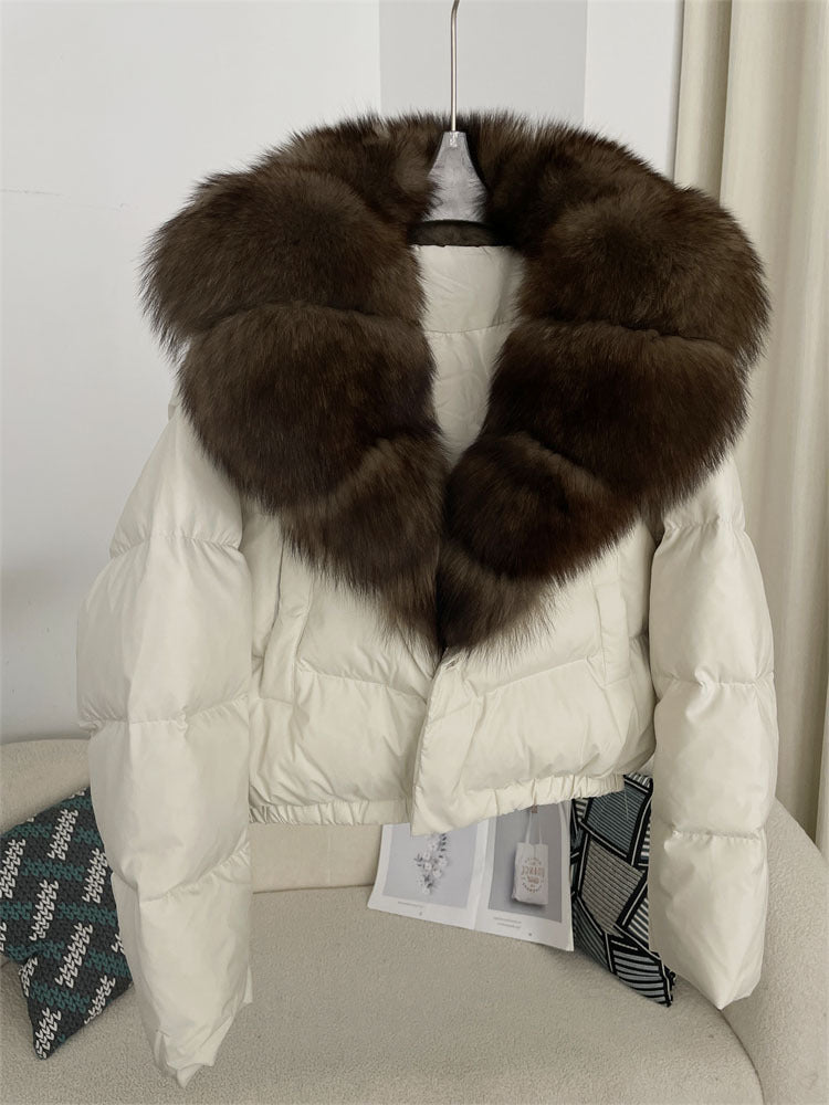 Women's short fashionable warm down jacket with a stylish and oversized real fox fur collar